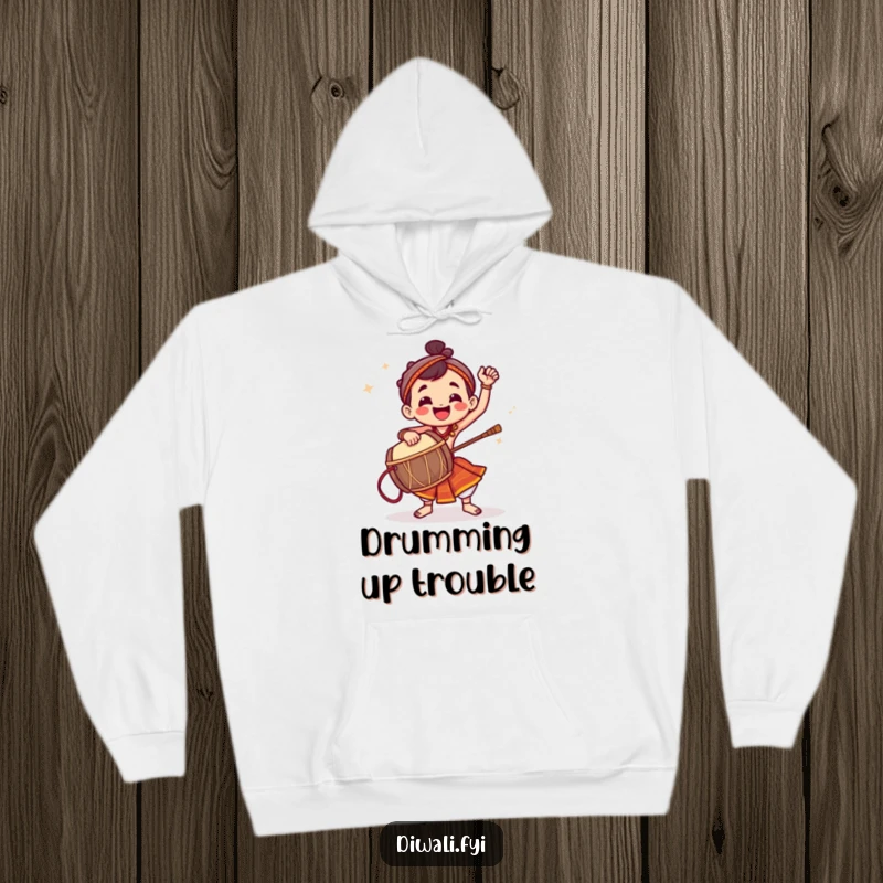 Funny hoodie depicting a jubilant character energetically pounding a dhol drum with vibrant rhythm.